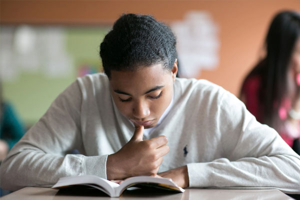 Teen boy reading