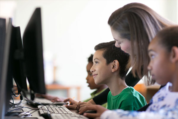 Boy testing on a computer