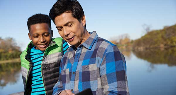 Teacher outdoors with student