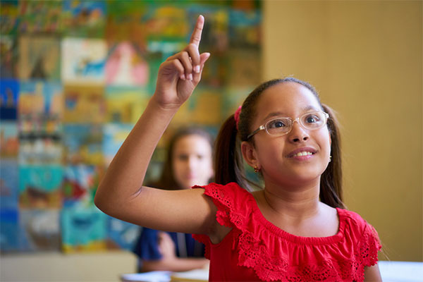 Girl with hand raised