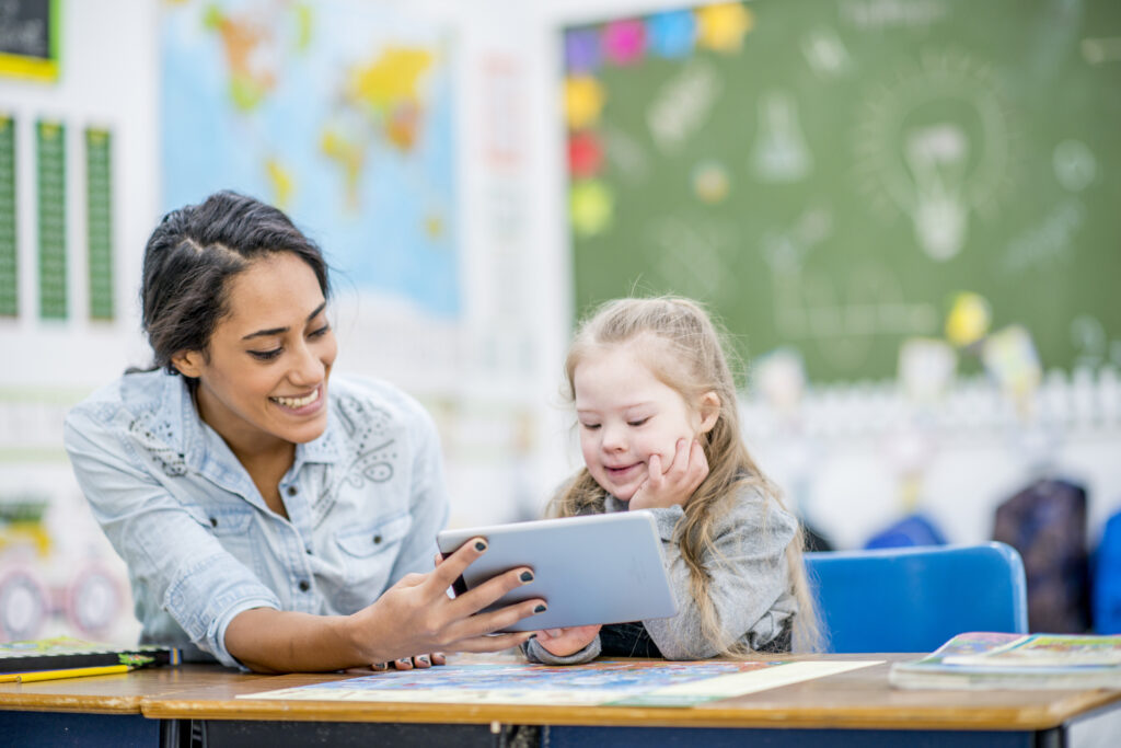 teaching reviewing tablet with student